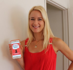 Jessica Schmidt from Executive Sutra holding her e-book 